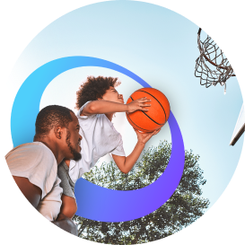 Father and son shooting a basketball